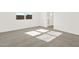 Carpet flooring with bathroom and window view at 17457 W Eva St, Waddell, AZ 85355