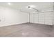 Spacious two-car garage with a sealed concrete floor and automatic garage door opener at 17457 W Eva St, Waddell, AZ 85355
