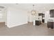 Open kitchen featuring a center island with granite countertops and stainless steel appliances at 17457 W Eva St, Waddell, AZ 85355