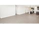 Spacious living room showcasing sleek tile flooring and ample natural light at 17457 W Eva St, Waddell, AZ 85355