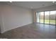 Bright living room with tile flooring and sliding glass doors leading to the backyard at 19315 W Luke Ave, Litchfield Park, AZ 85340