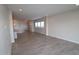 Spacious living room with tile flooring and recessed lighting, offering a clean, modern aesthetic at 19315 W Luke Ave, Litchfield Park, AZ 85340