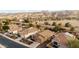 Aerial view of houses with solar panels and mountain backdrop at 2023 E Fawn Dr, Phoenix, AZ 85042