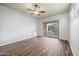 Bright bedroom with wood flooring and sliding glass door to patio at 2023 E Fawn Dr, Phoenix, AZ 85042