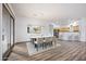 Bright dining room features hardwood floors and modern light fixture at 2023 E Fawn Dr, Phoenix, AZ 85042