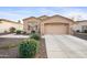 Tan house with two car garage and desert landscaping at 2023 E Fawn Dr, Phoenix, AZ 85042