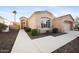 Tan house with stone accents and a two-car garage at 2023 E Fawn Dr, Phoenix, AZ 85042