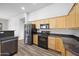 Kitchen with granite countertops and black appliances at 2023 E Fawn Dr, Phoenix, AZ 85042