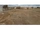 Large vacant lot with sparse vegetation at 21032 W Skinner Rd, Wittmann, AZ 85361