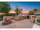 Brick firepit and BBQ area with built in seating at 21086 E Mewes Rd, Queen Creek, AZ 85142