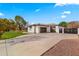 House exterior featuring a two-car garage and modern gate at 21086 E Mewes Rd, Queen Creek, AZ 85142