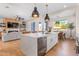 Open concept kitchen with island and living room view at 21086 E Mewes Rd, Queen Creek, AZ 85142