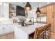 Modern kitchen with white cabinets, large island, and stainless steel appliances at 21086 E Mewes Rd, Queen Creek, AZ 85142