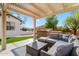 Covered patio furniture with built-in BBQ at 21086 E Mewes Rd, Queen Creek, AZ 85142