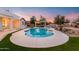 Beautiful kidney-shaped pool with a large patio at 21086 E Mewes Rd, Queen Creek, AZ 85142