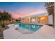 Expansive pool and patio with home view at sunset at 21086 E Mewes Rd, Queen Creek, AZ 85142