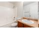 Bathroom with a vanity sink, neutral walls, tile flooring, and a shower-tub combo with white tile at 2159 S Luther --, Mesa, AZ 85209