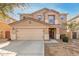 Two-story home featuring a tan exterior, a two-car garage, and manicured landscaping at 2159 S Luther --, Mesa, AZ 85209