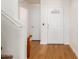 Bright foyer with hardwood floors and a white front door with decorative window at 2159 S Luther --, Mesa, AZ 85209