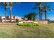 Community signage for Marbella surrounded by landscaping and palm trees under a bright blue sky at 2159 S Luther --, Mesa, AZ 85209