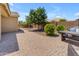 Landscaped backyard with patio and pathway at 2218 E Gillcrest Rd, Gilbert, AZ 85298