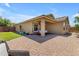 Covered patio, string lights, and grassy backyard at 2218 E Gillcrest Rd, Gilbert, AZ 85298