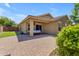 Covered patio, string lights, and grassy backyard at 2218 E Gillcrest Rd, Gilbert, AZ 85298