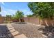 Landscaped backyard with a playhouse and gravel at 2218 E Gillcrest Rd, Gilbert, AZ 85298