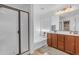 Bathroom with double vanity, soaking tub and walk-in shower at 2218 E Gillcrest Rd, Gilbert, AZ 85298