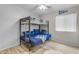 Bedroom with a full-size bunk bed and wood floors at 2218 E Gillcrest Rd, Gilbert, AZ 85298