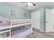 Bedroom featuring a bunk bed and light teal walls at 2218 E Gillcrest Rd, Gilbert, AZ 85298