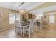 Dining area with table and chairs, view into kitchen and Gathering room at 2218 E Gillcrest Rd, Gilbert, AZ 85298