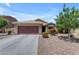 Single-story home with attached garage and landscaped front yard at 2218 E Gillcrest Rd, Gilbert, AZ 85298