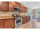 Bright kitchen with stainless steel appliances and granite countertops at 2218 E Gillcrest Rd, Gilbert, AZ 85298