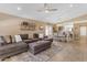 Open living room featuring L-shaped sofa and adjacent dining area at 2218 E Gillcrest Rd, Gilbert, AZ 85298