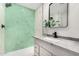 Modern bathroom with hexagon tile shower and gray vanity at 252 S Cholla St, Gilbert, AZ 85233