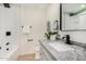 Modern bathroom with a floating vanity and a large mirror at 252 S Cholla St, Gilbert, AZ 85233