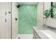 Modern bathroom with hexagon tile shower and gray vanity at 252 S Cholla St, Gilbert, AZ 85233