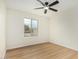 Bright bedroom with a ceiling fan and large window at 252 S Cholla St, Gilbert, AZ 85233