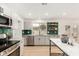 Modern kitchen with stainless steel appliances and farmhouse sink at 252 S Cholla St, Gilbert, AZ 85233