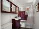 Bathroom with dark vanity and burgundy tile at 2533 E Cheery Lynn Rd, Phoenix, AZ 85016