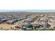 Aerial view of a house with pool, in a neighborhood near mountains at 25509 N 140Th Dr, Surprise, AZ 85387