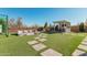 Artificial turf, fire pit, outdoor kitchen, and putting green at 25509 N 140Th Dr, Surprise, AZ 85387