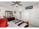 bedroom with red bed and sports decor at 25509 N 140Th Dr, Surprise, AZ 85387