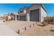 Two-story home with gray exterior, three-car garage, and landscaped front yard at 25509 N 140Th Dr, Surprise, AZ 85387