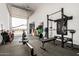 Home gym in the garage with a variety of equipment at 25509 N 140Th Dr, Surprise, AZ 85387