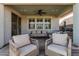 Covered patio with seating area and outdoor fan at 25509 N 140Th Dr, Surprise, AZ 85387