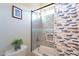 Full bathroom with tub/shower combo, mosaic tile and window at 26063 N 83Rd Dr, Peoria, AZ 85383