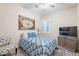 Guest bedroom with a ceiling fan and plenty of natural light at 26063 N 83Rd Dr, Peoria, AZ 85383