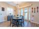 Kitchen dining area with a round table and four chairs at 26063 N 83Rd Dr, Peoria, AZ 85383